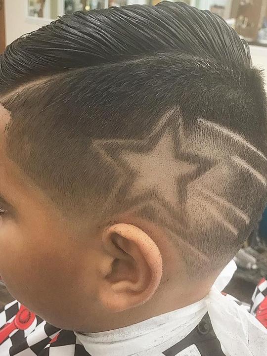 Star design shaved into a fade
